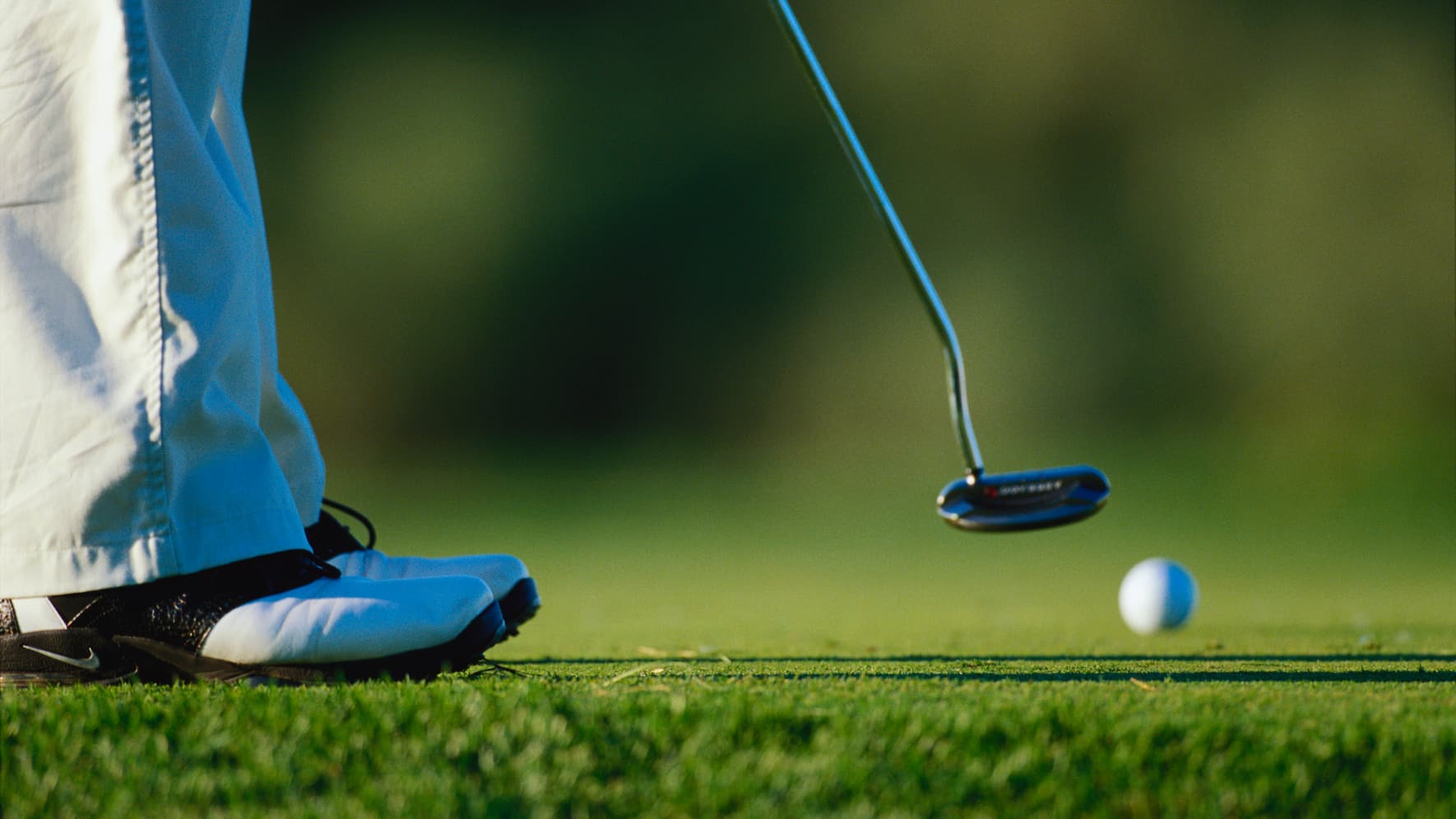 A golfer putting at the Hazeltine National Golf Course during the 2002 PGA Championship.