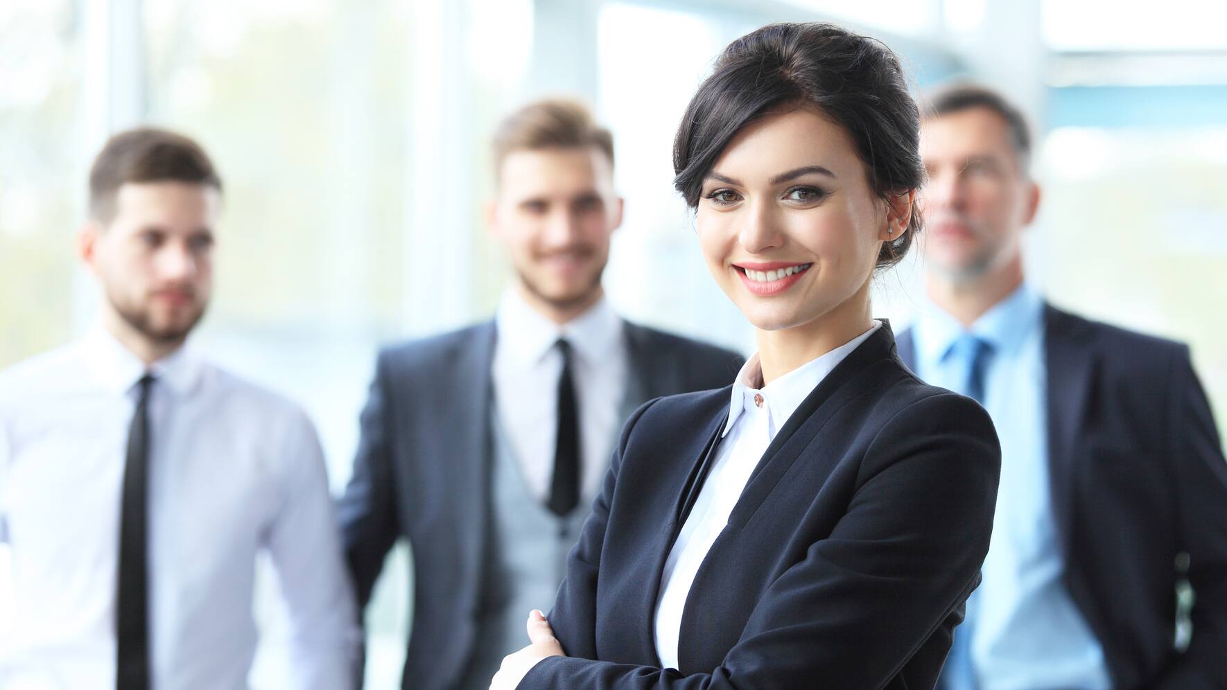 Face of beautiful woman on the background of business people