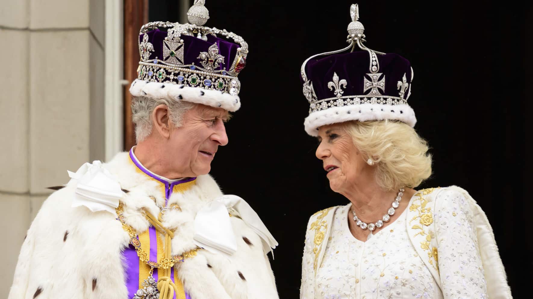 Britain's King Charles III and Queen Camilla stand on the balcony of the Buckingham Palace after their coronation, in London, Saturday, May 6, 2023. (KEYSTONE/Leon Neal/Pool Photo via AP)