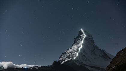 The Matterhorn mountain from Zermatt, Switzerland. Photographed at night, the lights are lanterns that follow the route the first explorers took to reach the peak. The Matterhorn mountain from Zermatt, Switzerland. Photographed at night, the lights are lanterns that follow the route the first explorers took to reach the peak.