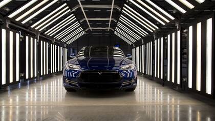 A Tesla Model S automobile stands in a light tunnel during quality control checks ahead of European shipping from the Tesla Motors Inc. factory in Tilburg, Netherlands, on Thursday, Oct. 8, 2015. Tesla said it delivered 11,580 vehicles in the third quarter, meeting its target after Chief Executive Officer Elon Musk handed over the first Model X sport utility vehicles just before the end of the period. Photographer: Jasper Juinen/Bloomberg A Tesla Model S automobile stands in a light tunnel during quality control checks ahead of European shipping from the Tesla Motors Inc. factory in Tilburg, Netherlands, on Thursday, Oct. 8, 2015. Tesla said it delivered 11,580 vehicles in the third quarter, meeting its target after Chief Executive Officer Elon Musk handed over the first Model X sport utility vehicles just before the end of the period. Photographer: Jasper Juinen/Bloomberg