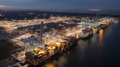 The Mediterranean Shipping Company ship MSC Meline, front, is in the process of being loaded at the Virginia International Gateway Marine terminal Wednesday Dec 1, 2021, in Norfolk, Va. (AP Photo/Steve Helber) The Mediterranean Shipping Company ship MSC Meline, front, is in the process of being loaded at the Virginia International Gateway Marine terminal Wednesday Dec 1, 2021, in Norfolk, Va. (AP Photo/Steve Helber)