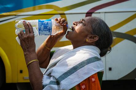 Heatwave In Kolkata, India A woman is drinking water from water bottles on a hot summer day in Kolkata, India on 13 April 2023. Met Office predicts heatwave in Kolkata and several West Bengal districts. According to the IMD special bulletin, an orange alert has been announced for the districts of South Bengal during April 12-16. Kolkata West Bengal India PUBLICATIONxNOTxINxFRA Copyright: xSudiptaxDasx originalFilename: das-heatwave230413_npjdS.jpg