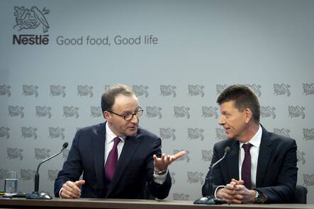 Nestle's CEO Ulf Mark Schneider, left, speaks with Nestle's CFO Francois-Xavier Roger.