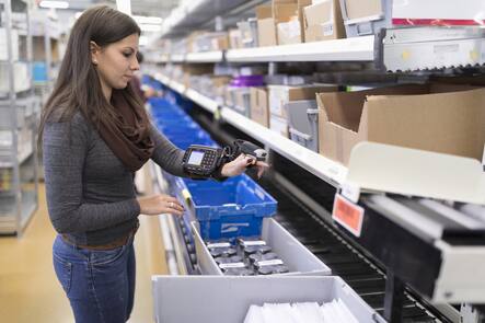 An employee uses a hand scanner to scan a barcode, pictured at the logistics center of the mail-order pharmacy Zur Rose in Frauenfeld, Canton of Thurgau, Switzerland, on November 17, 2016. The mail-order pharmacy Zur Rose sends pharmaceuticals to physicians and directly to individual customers when prescriptions are produced. (KEYSTONE/Gaetan Bally)