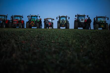 Farmers organize themselves to form a giant "SOS" distress signal with their tractors as coordinated stunt replicated in various locations across Switzerland, protesting against their work conditions and here specifically the price of milk, echoing numerous protests accross Europe in the recents weeks, in a field between the villages of Echallens and Goumoens-la-Ville, Switzerland, Thursday, February 29, 2024. (KEYSTONE/Valentin Flauraud)