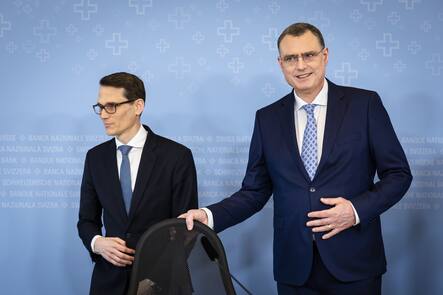 Swiss National Bank's (SNB) Chairman of the Governing Board Thomas Jordan, right, arrives with Vice Chairman of the Governing Board Martin Schlegel, left, to a media briefing at the Swiss National Bank in Zurich, Switzerland, on Thursday, March 21, 2024. (KEYSTONE/Michael Buholzer).