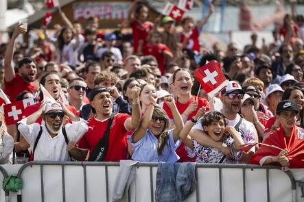 Swiss soccer fans react during the live broadcast of the UEFA EURO 2024 soccer match between Hungary and Switzerland in a fan zone in Lausanne, Switzerland, Saturday, 15. June 2024.(KEYSTONE/Cyril Zingaro)