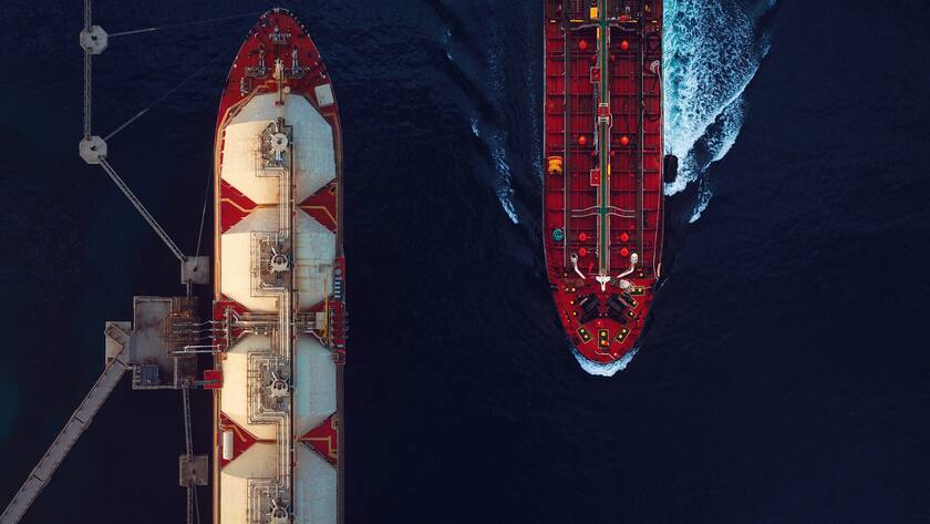 High angle view of a crude oil tanker passing by a moored LNG floating storage tanker.