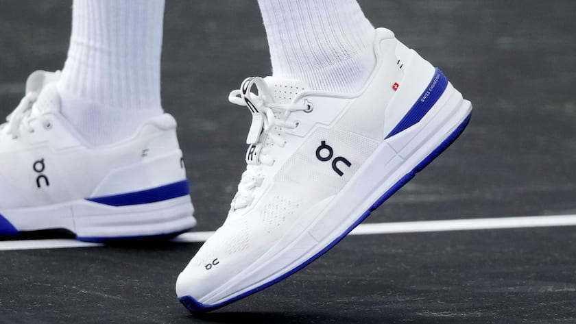 Switzerland's Roger Federer sports a pair of shoes as he attends a training session ahead of the Laver Cup tennis tournament at the O2 in London, Wednesday, Sept. 21, 2022. Federer appeared earlier at a news conference to discuss his retirement from professional tennis at age 41 after a series of knee operations. He will close his career with a doubles match at the Laver Cup on Friday . (AP Photo/Kin Cheung)