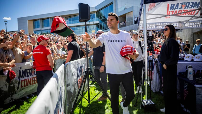 KEYPIX - Charlie Kirk hands out hats before speaking at Utah Valley University in Orem, Utah, Wednesday, Sept. 10, 2025. (Tess Crowley/The Deseret News via AP)