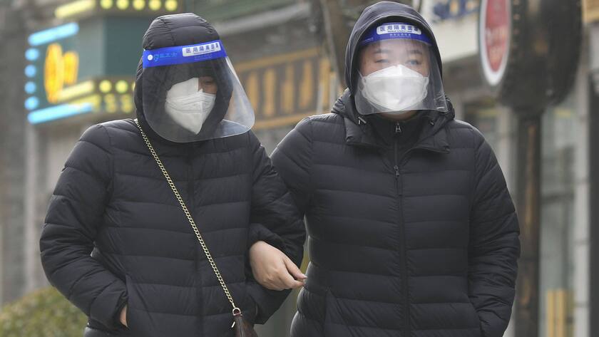 China s faltering zero-COVID policy Residents wearing face shields walk on a street in Beijing on Dec. 12, 2022, where a surge in outbreaks tests China s easing of its zero-COVID policy. PUBLICATIONxINxGERxSUIxAUTxHUNxONLY A14AA0001374755P