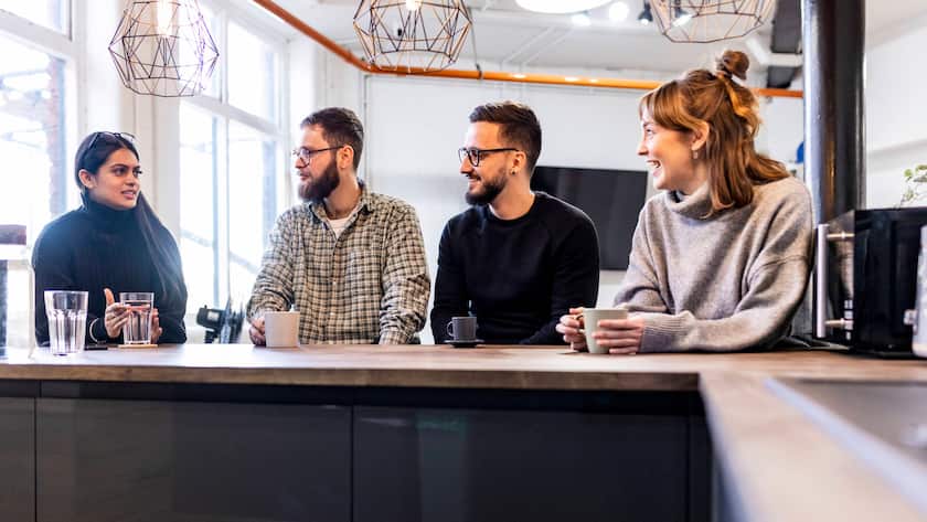 Happy businessmen and businesswomen taking break and talking with each other in office cafeteria model released, Symbolfoto property released, WPEF07500