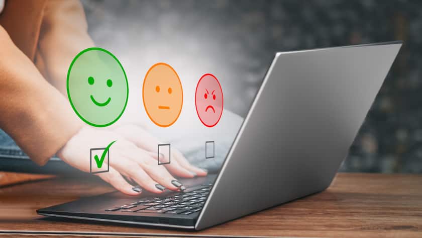 woman use laptop choosing green happy smile face icon. mental health concept. world mental health day concept