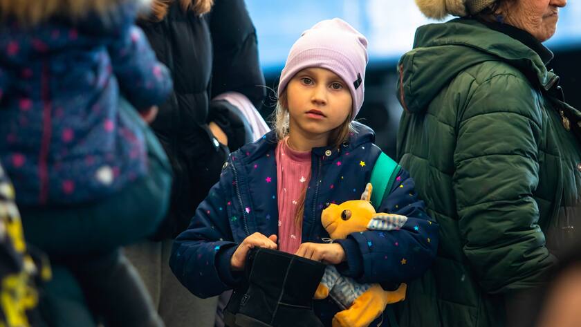 March 24, 2022, Lviv, Lviv Oblast, Ukraine: A young refugee from Mariupol holds boots and a stuffed animal. A train carrying refugees from war torn Mariupol arrived at the Lviv train station. Many will continue their journey from Lviv out of Ukraine. Lviv Ukraine - ZUMAs197 20220324_zab_s197_005 Copyright: xTyxONeilx