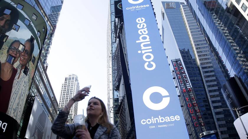 The Coinbase logo is displayed on screens in Times Square when Coinbase Global, Inc. beings trading under the symbol COIN at the Nasdaq Opening Bell in New York City on Wednesday, April 14, 2021. Coinbase runs the largest bitcoin exchange in the U.S. and is the first major cryptocurrency-focused company to go public in the country PUBLICATIONxINxGERxSUIxAUTxHUNxONLY NYP20210414106 JohnxAngelillo