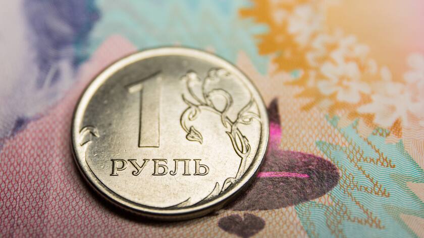 SWEDEN - 2022/03/09: In this photo illustration, the obverse of the Russian 1-ruble coin and Ukrainian 200-hryvnias banknote with the image of Lesya Ukrainka are seen displayed. (Photo Illustration by Karol Serewis/SOPA Images/LightRocket via Getty Images)