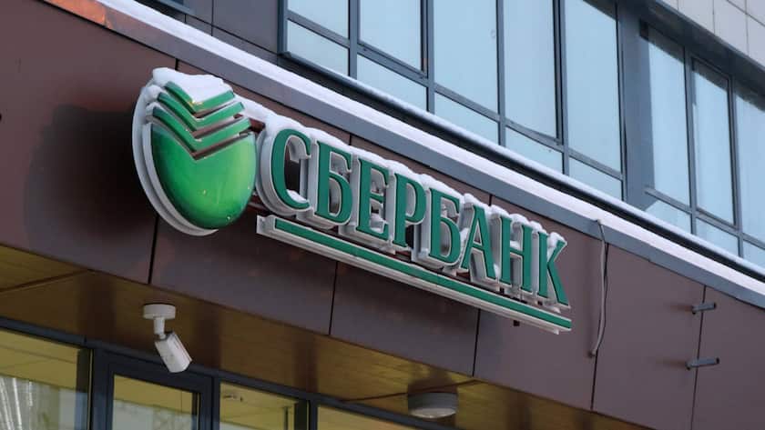 Russia. Leningrad region, Murino, satellite city of St. Petersburg, Devyatkino. Citizens receive money at a bank branch. Bank signage. Sberbank