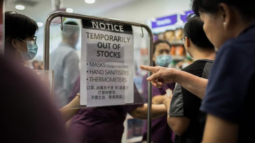 SINGAPORE - 2020/02/14: People lines up to purchase protective face masks in a local pharmacy in Singapore.Singapore declared the COVID-19 outbreak as Code Orange on February 7, 2020. (Photo by Maverick Asio/SOPA Images/LightRocket via Getty Images)
