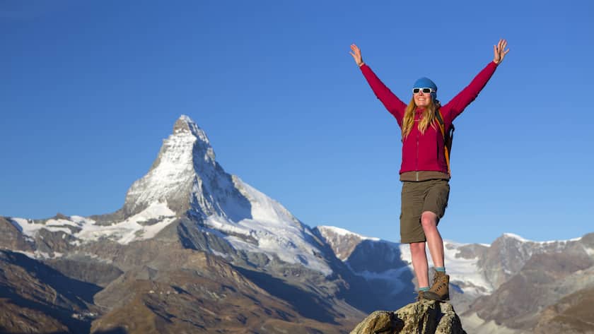 Happy Female Hiker Greeting First Sunlight In The Swiss Alps Above Zermatt, Zermatt Wallis Switzerland model released Symbolfoto PUBLICATIONxINxGERxSUIxAUTxONLY Copyright: MennoxBoermans BOME000415