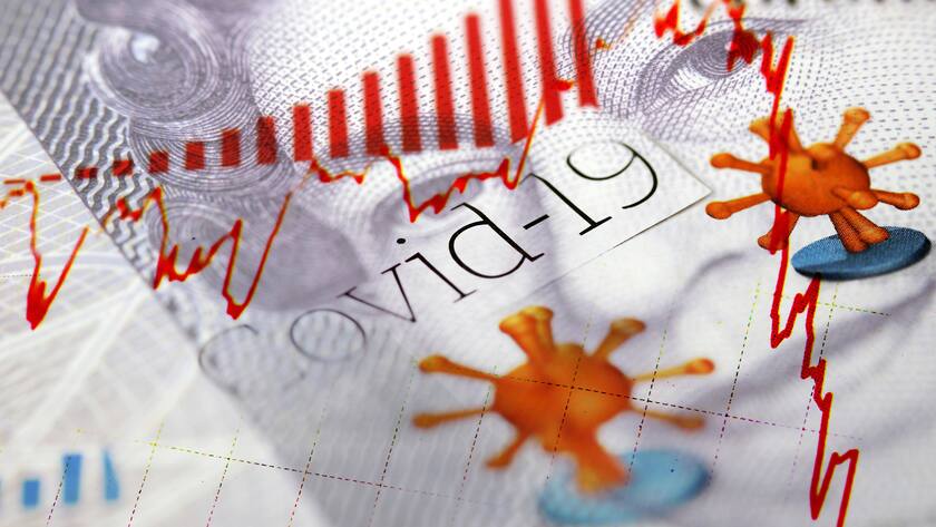 UK Pound Sterling banknote combined with Corona / Covid-19 newspaper headlines and red declining financial market trend