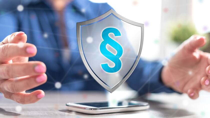 Smartphone with legal protection concept between hands of a woman in background