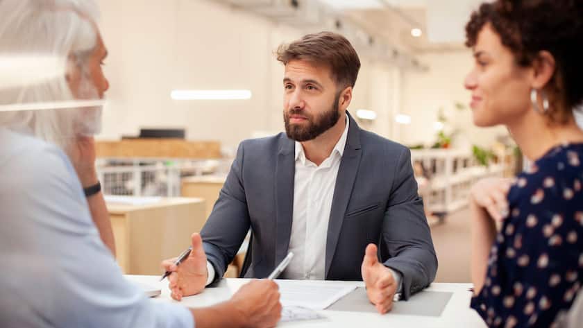 Male lawyer discussing over contract with adult couple Copyright: DinocoxGreco B24736248 RECORD DATE NOT STATED