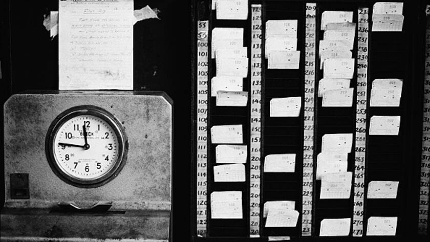 A mechanical time clock (or punch clock) and a rack of time cards at Stockwell Bus Garage, south London, 26th February 1967. (Photo by Chris Morphet/Getty Images)