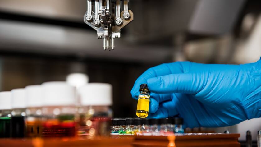 Pacific Northwest National Laboratories researchers at the Bioproducts Sciences and Engineering Laboratory at WSU-Tri-Cities use a robot to prepare high throughput samples for a variety of projects.