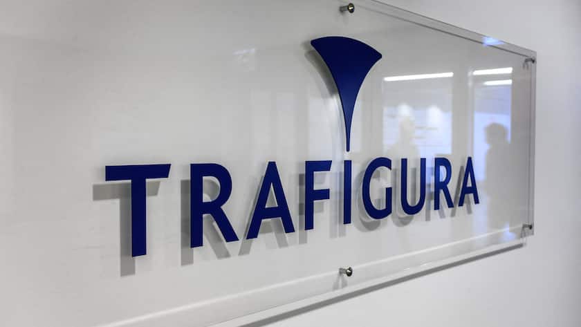 The name and logo of the multinational commodity trading company Trafigura is pictured in the company's offices entrance in Geneva, on November 24, 2020. (Photo by Fabrice COFFRINI / AFP)