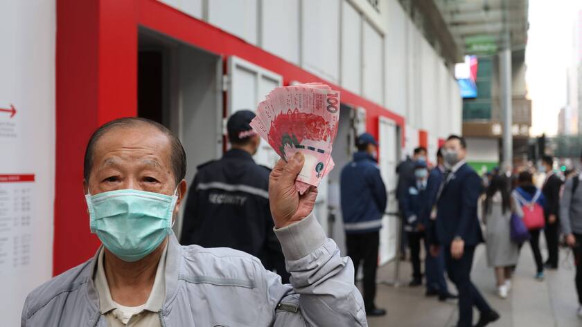 January 26, 2021, Hong Kong, CHINA: Mr Cheung full name withheld exchanges HK$3,000 new banknotes for Lunar New Year red packets at the HSBC branch in Mong Kok. A portion of the tickets can be ordered online as special arrangement amid the Covid-19 pandemic. 26JAN21 SCMP / Hong Kong CHINA - ZUMAs251 20210126_zin_s251_002 Copyright: xNoraxTamx