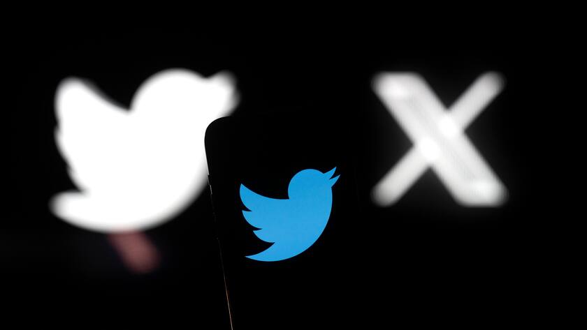 Elon Musk Changes Twitter Bird Logo To X A Twitter logo is seen with X and Twitter logos in the background in this photo illustration on 23 July, 2023 in Warsaw, Poland. Warsaw Poland PUBLICATIONxNOTxINxFRA Copyright: xJaapxArriensx originalFilename: arriens-elonmusk230723_npps0.jpg