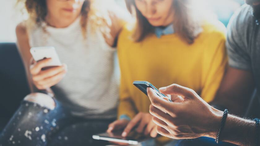 Closeup Bearded Hipster Man Using Modern Smartphone.Business People Gathered Together Discussing Creative Idea Sofa Cafe.Coworkers Meeting Brainstorming Discussion Work Startup Concept Office