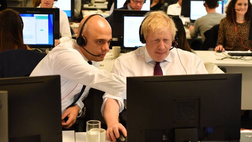 LONDON, UNITED KINGDOM - DECEMBER 8: Britain's Chancellor of the Exchequer Sajid Javid (L) and Britain's Prime Minister Boris Johnson (R) man the phones at the Conservative Campaign Headquarters Call Centre on December 8, 2019 in central London. Britain will go to the polls on December 12, 2019 to vote in a pre-Christmas general election. (Photo by Ben Stansall - WPA Pool/Getty Images)