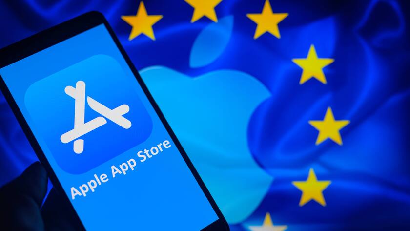 The Apple App Store icon is displayed on a smartphone with Apple Inc logo visible in the background in this photo illustration.