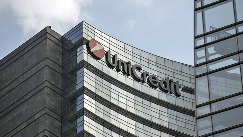 A logo sits on the exterior of the UniCredit SpA bank headquarters office as it stands in Milan, Italy, on Wednesday, April 13, 2016.