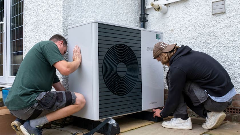 Air source heat pump installers from Solaris Energy installing a Vaillant Arotherm plus 7kw air source heat pump unit into a 1930s built house in Folkestone, United Kingdom on the 20th of September 2021. With gas prices increasing and the increasing need to reduce fossil fuel air source heat pumps are slowly starting to replace the gas boiler use in properties in the UK. (photo by Andrew Aitchison / In pictures via Getty Images)