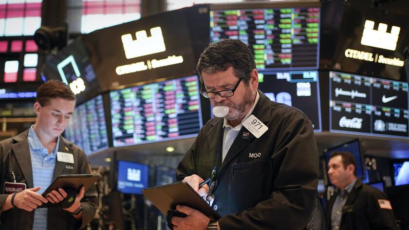 Traders work on the floor at the New York Stock Exchange in New York, Friday, July 1, 2022. Stocks are off to a weak start on Friday, continuing a dismal streak that pushed Wall Street into a bear market last month as traders worry that inflation will be tough to beat and that a recession could be on the way as well. (AP Photo/Seth Wenig)