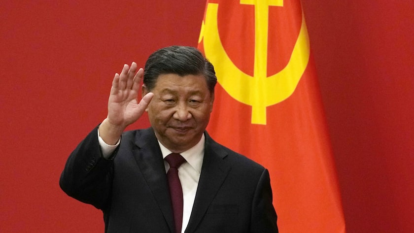 FILE - Chinese President Xi Jinping waves at an event to introduce new members of the Politburo Standing Committee at the Great Hall of the People in Beijing on Oct. 23, 2022. China on Friday, Nov. 11, confirmed President Xi Jinping will attend both the meeting of the Group of 20 industrialized countries and the gathering of Asian Pacific nations this month in his first major overseas trip since the beginning of the COVID-19 pandemic. (AP Photo/Andy Wong, File)