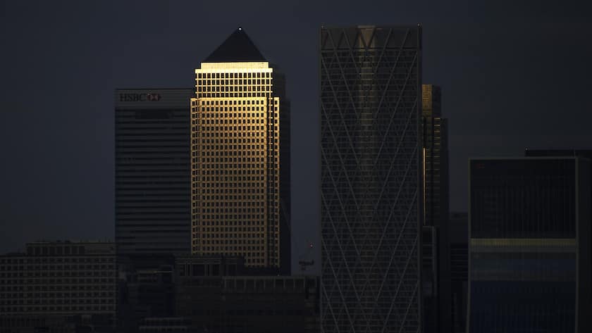 General view of the skyline of the financial district of Canary Wharf as the sun sets, in London, Saturday, May 8, 2021. Millions of people across Britain have voted on Thursday, in local elections, the biggest set of votes since the 2019 general election.(AP Photo/Alberto Pezzali)