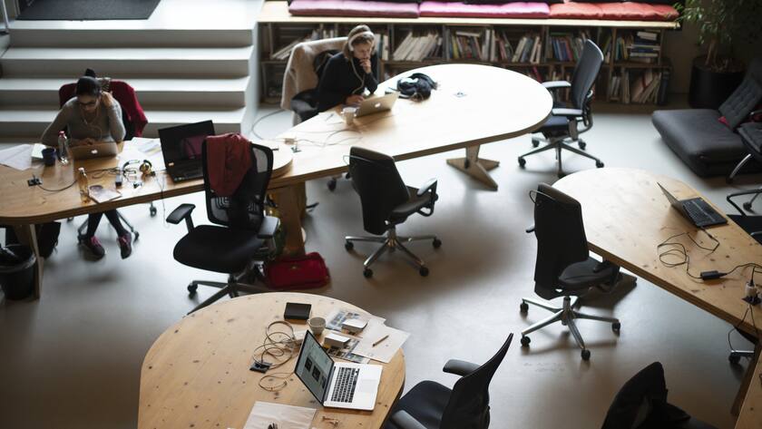 People work at the coworking space Impact Hub Zuerich Viadukt in Zurich, Switzerland, on April 11, 2019. (KEYSTONE/Gaetan Bally)