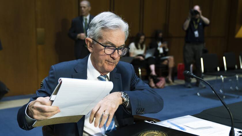 Federal Reserve Chairman Jerome Powell prepares his documents as he arrives present to the Senate Banking, Housing and Urban Affairs Committee, the Monetary Policy Report on Capitol Hill, Wednesday, June 22, 2022, in Washington. (AP Photo/Manuel Balce Ceneta)