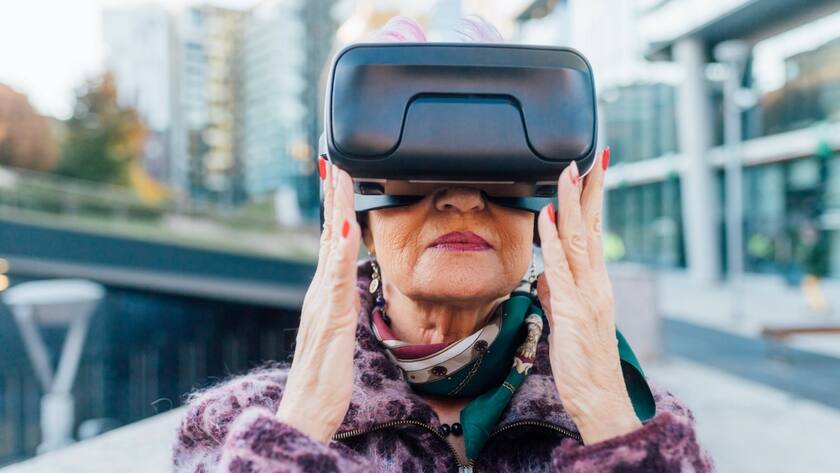 Italy, Fashionable senior woman with VR goggles in city Italy, Fashionable senior woman with VR goggles in city
