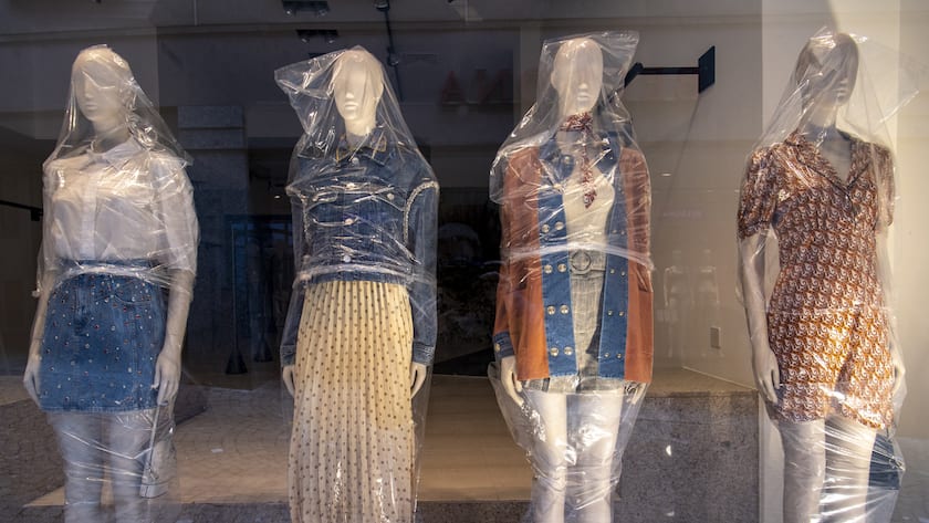 Female display dummies with clothes are covered with plastic in the window of a closed clothes shop in a shopping street (Rue de Bourg) during the Covid-19 Coronavirus pandemic in Lausanne, Switzerland, Monday, March 23, 2020. The Swiss authorities proclaimed on 16 March a state of emergency in an effort to halt the spread of the coronavirus and (Covid-19) disease.