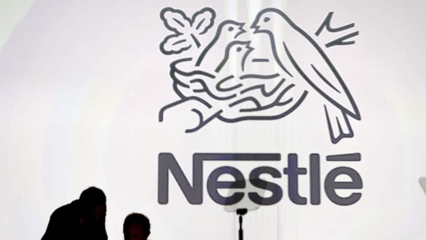 Nestle's directors speak in front of the Nestle's logo during the general meeting of the world's biggest food and beverage company, Nestle Group, in Lausanne, Switzerland, Thursday, April 7, 2016. (KEYSTONE/Laurent Gillieron)