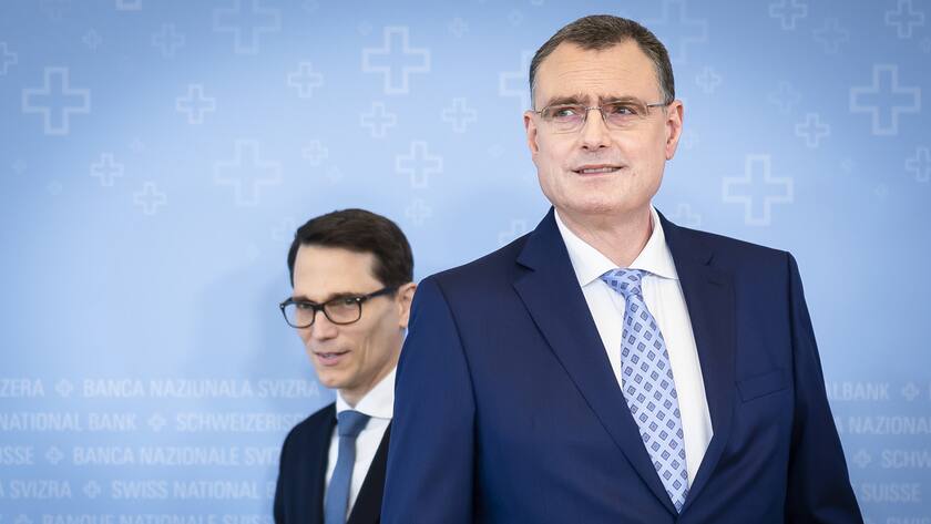 Swiss National Bank's (SNB) Chairman of the Governing Board Thomas Jordan, right, arrives with Vice Chairman of the Governing Board Martin Schlegel, left, to a media briefing at the Swiss National Bank in Zurich, Switzerland, on Thursday, March 21, 2024. (KEYSTONE/Michael Buholzer).