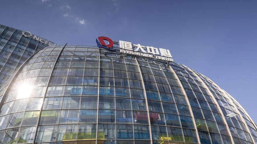 Evergrande Center building is seen in Shanghai, China, 23 September 2021. China Evergrande Group's central unit, Hengda Real Estate Group, announced it would settle interest payment on its Shenzhen-trade 5.8 percent September 2025 bond, according to the Group's statement on 22 September.
