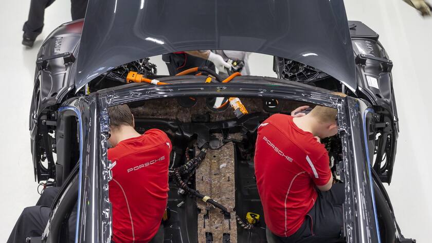 epa08271959 A view of the production of Taycan electric sports cars at an assembly line at the German car manufacturer Porsche in Stuttgart, Germany, 05 March 2020. Porsche AG is a listed German manufacturer of luxury sports cars, SUVs and sedans based in Stuttgart. Porsche AG will present the results of the 2020 financial year at the annual press conference on 24 March 2020. EPA/RONALD WITTEK