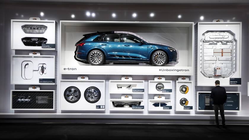 epa07836418 A man looks at automobile components of an Audi E-Tron at the International Motor Show (IAA) in Frankfurt, Germany, 12 September 2019. The 2019 International Motor Show Germany IAA 2019, which this year promotes itself under the motto 'Driving tomorrow', takes place in Frankfurt am Main from 12 to 22 September 2019. The IAA 2019 will also feature numerous world premieres, and has a special focus on electric mobility and digitization. EPA/FELIPE TRUEBA