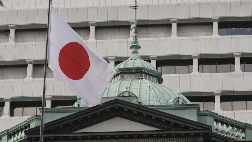 A Japanese national flag flutters at headquarters of the Bank of Japan in Tokyo, Japan, 19 December 2023.